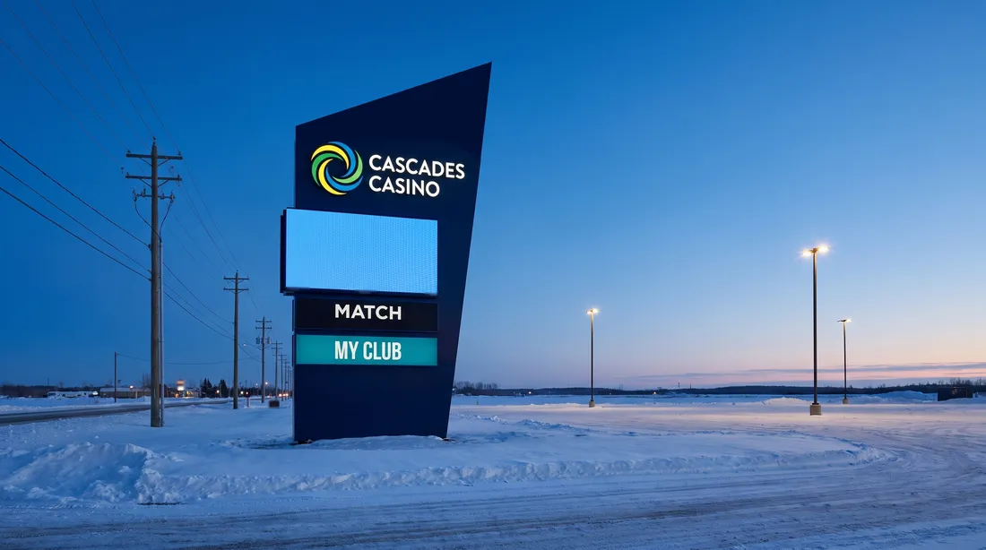 Cascades Casino pylon sign by the road at dusk